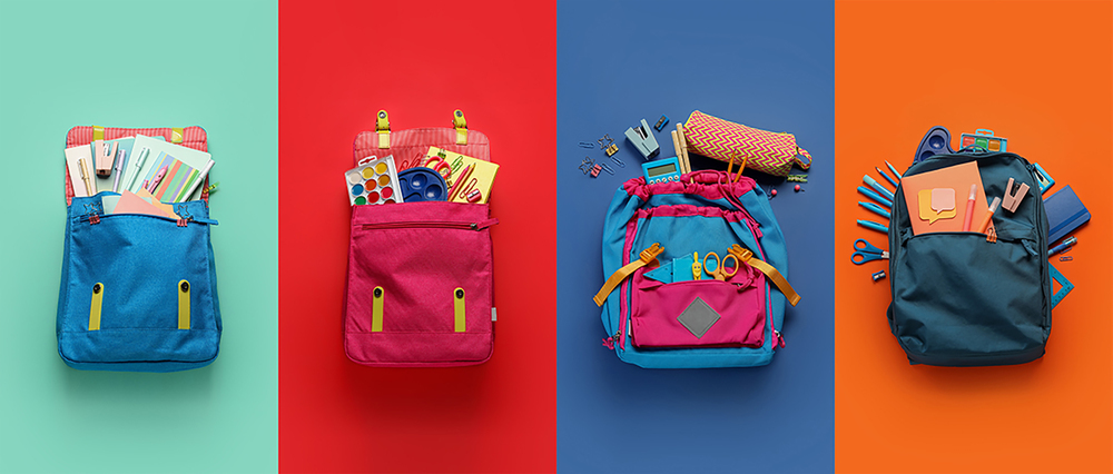 Backpacks filled with a variety of school supplies, aligned and on different background colors.