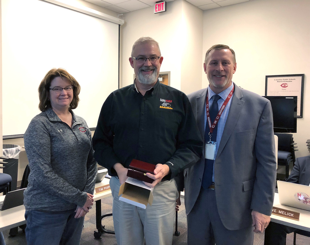 Tim Pospisil was honored by the CPS Board of Education for his services.